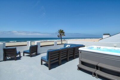 Beautiful, one-of-a-kind upper unit with incredible roof-top deck with hot tub