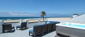 Beautiful, one-of-a-kind upper unit with incredible roof-top deck with hot tub