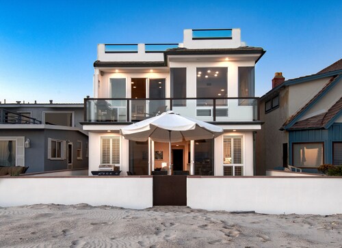 Beautiful, one-of-a-kind upper unit with incredible roof-top deck with hot tub