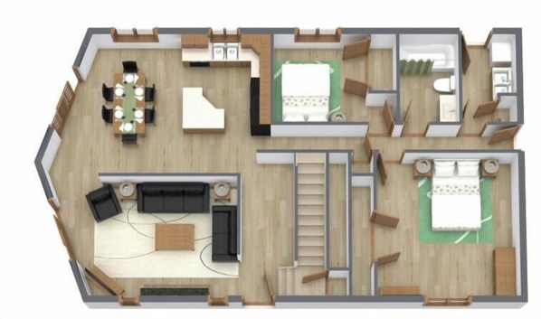 Un plan d’étage d’un hôtel comprenant un espace repas, un salon, une chambre et une salle de bain.