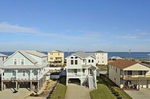 A beachfront residential area with houses featuring balconies and a clear view of the ocean. - KH4004- Oceanside-5 BRs, Elevator, Pool Table, Private Pool and Hot Tub! (Kitty Hawk)