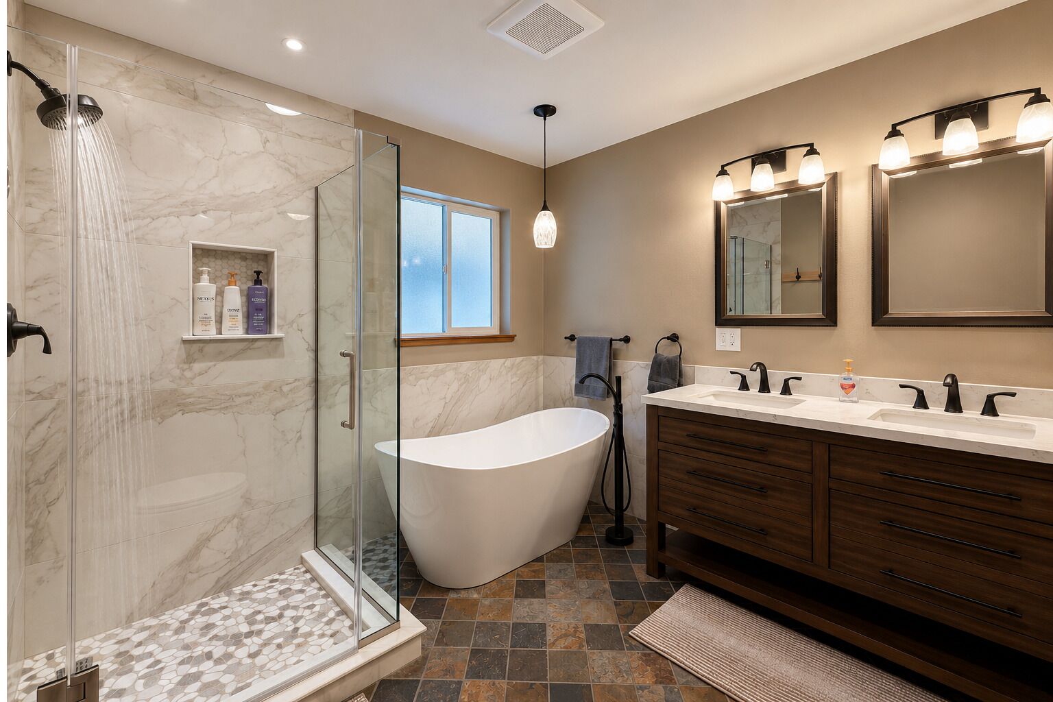 En Suite with heated floors, shower, bathtub, towels and hairdryer.