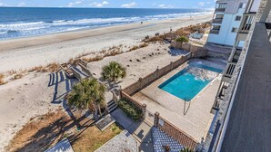 A beachfront property with a swimming pool, beach access, and a view of the ocean. - *20% Off New Summer 2026 Bookings* (Surfside Beach)