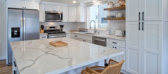 Spectacular ocean views await you from the large patio at this newly remodeled lower unit!