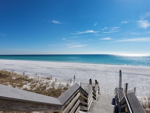 A wooden boardwalk leading to a beach with a clear blue sky. - Walk to Beach, Sun Room, Open Living Area, Free Beach Chair Service (Miramar Beach)