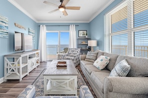 Relax in this inviting space with a comfortable sofa, coffee table, and flat-screen TV.