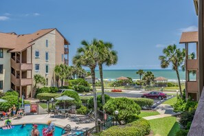 Relax by the pool surrounded by lush greenery and take in the breathtaking ocean views.