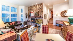 A cozy living room with a fireplace, a sofa set, a coffee table, and a dining area. - Labor Day Sale - Limited Time Offer, Save up to 30% (Park City)