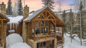 A log cabin with a balcony and a private property sign. - Lodge-Style Home by InvitedHome | Vast Patio, Hot Tub, Walk to Ski, Fireplace (Mountain Village)