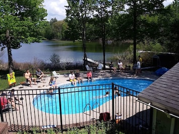 Outdoors - Pool (unavailable in winter), fire pit, charcoal grill, dock, kayak, canoe, row boat, life vests, grassy yard, fishing rods, patio, outdoor dining table & chairs, badminton, softball equipment, basketball hoop.