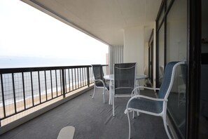 Outdoor dining - Relaxing, comfortably-styled 2 bedroom oceanfront condo with free WiFi,  and a fabulous view of the ocean located uptown just steps to the beach! (Ocean City)