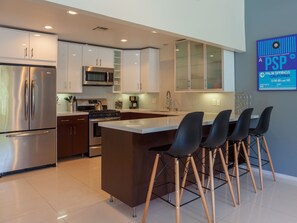 Fridge, microwave, oven, stovetop - Atomic Ranch Heaven - Midcentury Pool Retreat (Palm Springs)