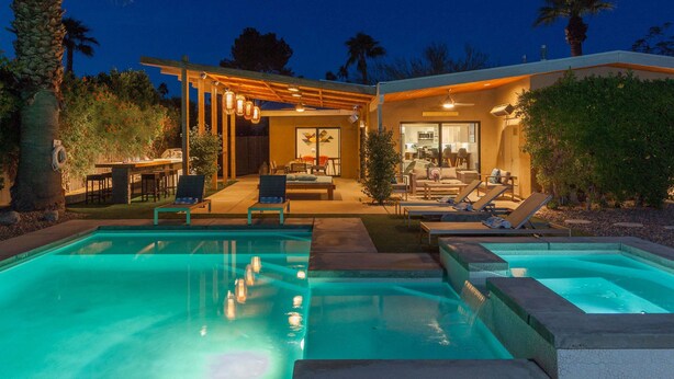 A modern house with a pool, outdoor seating, and a covered patio. - Atomic Ranch Heaven - Pool, Spa & Mountain Views (Palm Springs)