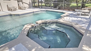 A swimming pool with a hot tub, lounge chairs, and a patio area. - 4 Mi to Disney: Kissimmee Group Getaway (Kissimmee)