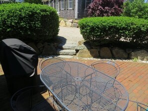 Outdoor dining - This lovely condo location in town, has both a brick patio and deck for you to enjoy your morning coffee on! (Chatham)