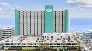 A hotel with a large parking lot and a view of the ocean. - *Fall into Savings-20% Off New Bookings thru 2026* (Murrells Inlet)