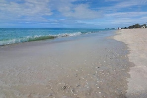 A beach with clear skies and calm waters.