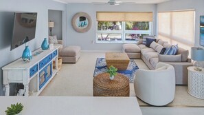 Flat-screen TV, books, video library