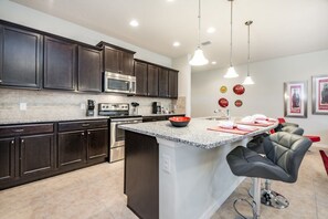 Fridge, microwave, oven, stovetop - How to Rent Your Perfect Orlando Home on Windsor at Westside, Townhome Orlando 1769 (Kissimmee)