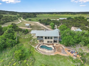 View of the back of the house - Rio Cantando I Blanco River, Pool, Hot Tub, Game Room (Wimberley)