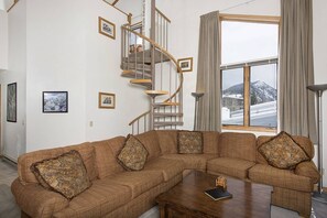 TV, fireplace - Slope-Side Ski Run Condo: Walk to Lifts, Indoor Pool, Hot Tub, Sauna and Stunning Mountain Views (Keystone)