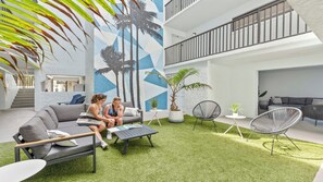 Terrace/patio - Sun-Soaked Ground Floor Corner Condo – W/ BBQ Grills, Heated Pool & Steps to the Pier! ☀️ (Cocoa Beach)