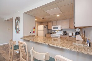 Fridge, microwave, oven, stovetop - Stylish, spacious 2 bedroom condo with free WiFi, an indoor pool, and HBO channels located uptown near mini golf and movie theater and only a block to the beach! (Ocean City)