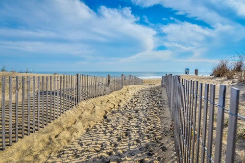 Stylish, upscale 3 bedroom condo with a television in every bedroom and living room, free WiFi, and two floors located downtown only a few streets from the boardwalk and only steps to the beach!