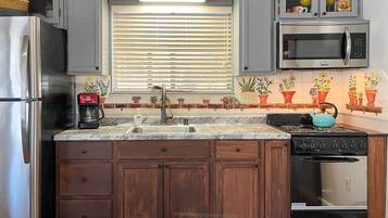 Fridge, microwave, stovetop, coffee/tea maker
