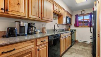 Microwave, stovetop, dishwasher, coffee/tea maker