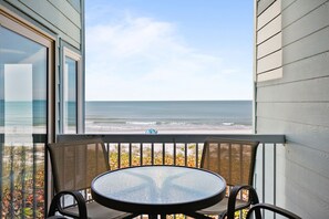 Outdoor dining - Seaside Beach House 205 · End Unit · 180° Lanai · Gulf View (Holmes Beach)