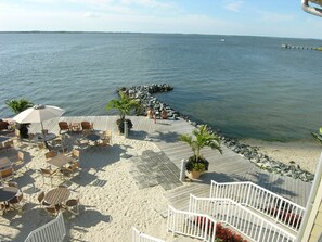 Outdoor dining - Exceptional Luxury 5 Bedroom Townhouse With WiFi In Gated Community On Bayside With Indoor/Outdoor Pools, Private Beaches, Restaurant, And More Just Ten Minutes From Beach! (Ocean City)