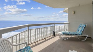 A balcony with a view of the ocean, white railings, and two patterned lounge chairs. - *Fall into Savings-20% Off New Bookings thru 2026* (Murrells Inlet)