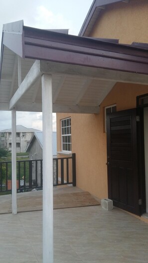 Adjacent to the building, a covered outdoor space offers a convenient waiting area.