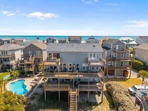 A beachfront property with a pool, multiple decks, and ocean views. - Sounds Like Fun - Relax Soundside with Your Pet! (North Topsail Beach)