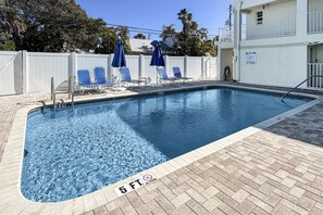 A swimming pool with blue water, a 5 ft depth marking, and a no diving sign. - Beachfront on Pass-A-Grille Beach with Pool! Walking Distance to Great Restaurants and Shops. (St. Pete Beach)