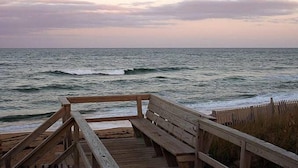A wooden pier with a bench overlooking the ocean. - Duck Haven - Tuckahoe, Easy Walk to Ocean, Pool, Hot Tub, Discounts! (Duck)
