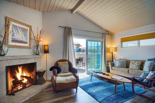 Beautiful newly remodeled upper unit located within the first block to beach!