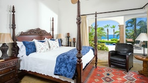 A four-poster bed with a view of the ocean through a glass door. - Ocean View 5 BR Luxury Villa Las Brisas Includes Private Pool, Jacuzzi & Wet Bar (San Jose del Cabo)
