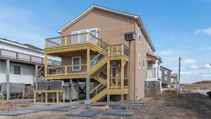 A two-story house with a wooden deck and a balcony. - Bali Hai - Kitty Hawk MP 3, 50 Yards to Beach, Breathtaking Views, Open Decks (Kitty Hawk)