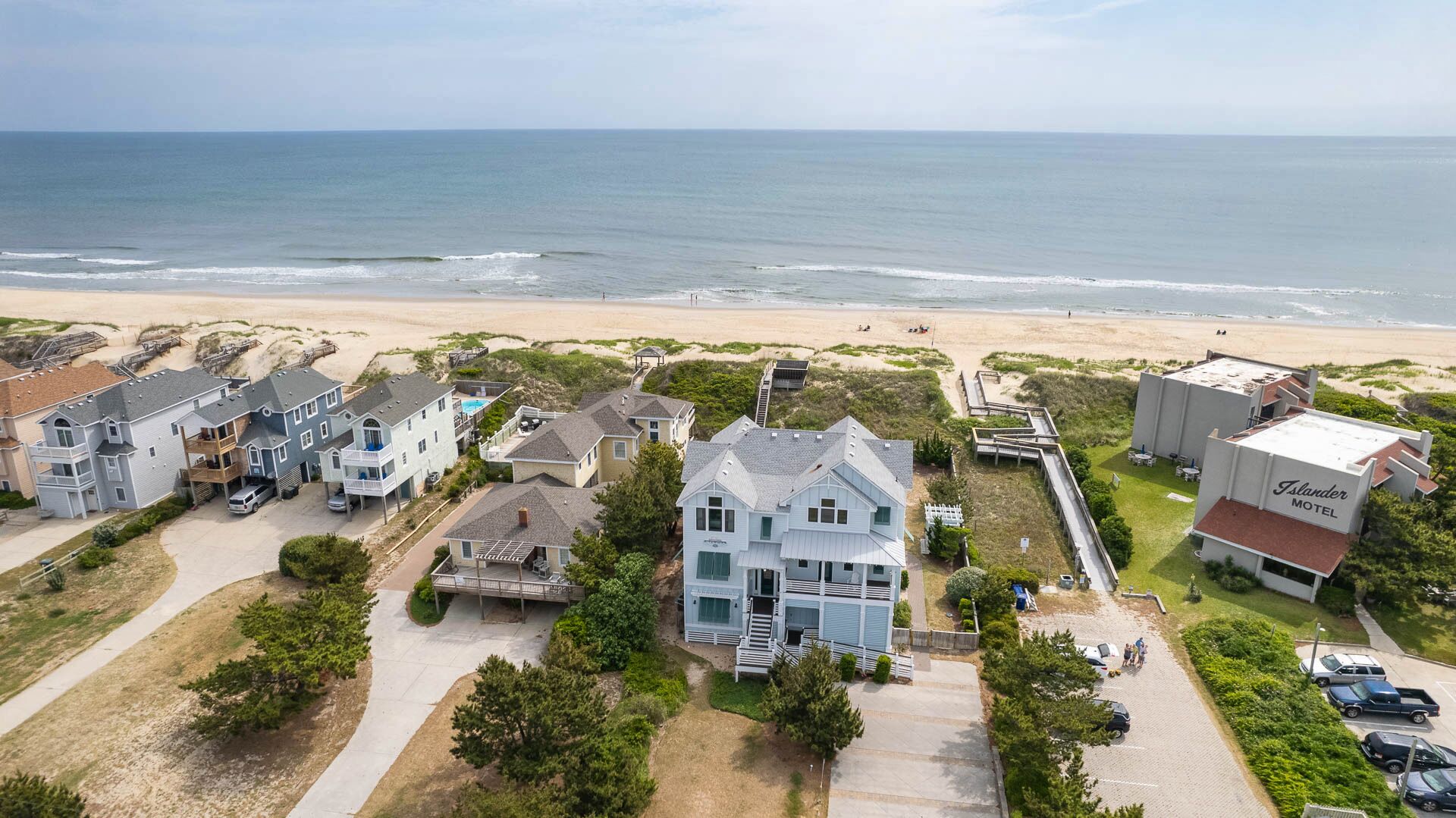 A coastal residential area with houses and a motel.
