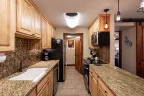 Oven, cleaning supplies, paper towels