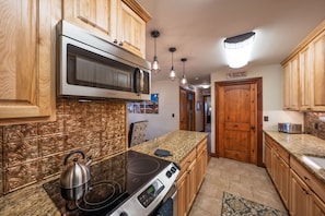 Oven, cleaning supplies, paper towels