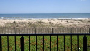 A beach view with a wooden fence in the foreground. - Well maintained 1 BR, 1.5 BA oceanfront condo. Enjoy the beautiful ocean views from your balcony and inside the unit. (Ocean City)