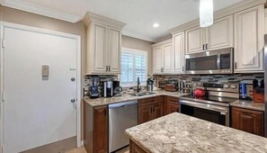Fridge, microwave, oven, stovetop - Condo # 111 Luxurious Living by Siesta Beach in this renovated 2b/1b ground floor unit (Sarasota)