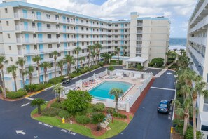 A heated pool - Gorgeous Beach Condo Balcony, Heated Pool, Tennis Court & Family Fun (Cocoa Beach)