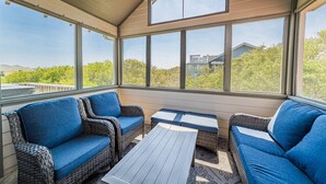 A sunroom with wicker furniture and large windows. - Rookery - Corolla, Whalehead, 395 Yds to Beach, Ocean View, Pool, Hot Tub, Pets OK, Flex Stays (Corolla)
