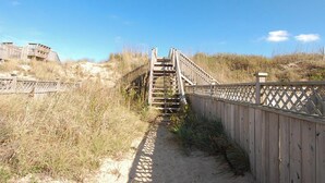 A wooden boardwalk leading to a staircase. - Fun 'N Sun - Nags Head MP 16, 250 Ft to Beach Access, Pool, Pets OK, YR Flex Stays (Nags Head)