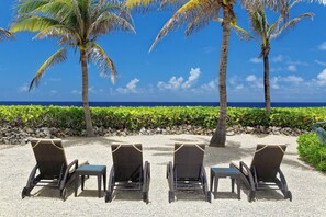 On the beach, sun loungers, beach towels