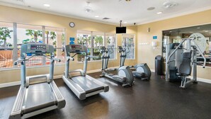 A gym with treadmills, elliptical machines, and weight equipment. - Spacious Kissimmee Villa - 3 Mi to Disney World! (Kissimmee)